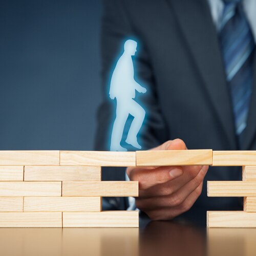 image of a man crossing a bridge 